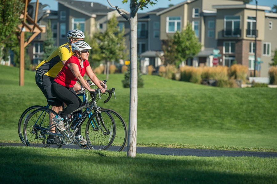 Lisa Brown Rides bicycle with her partner through Spokane